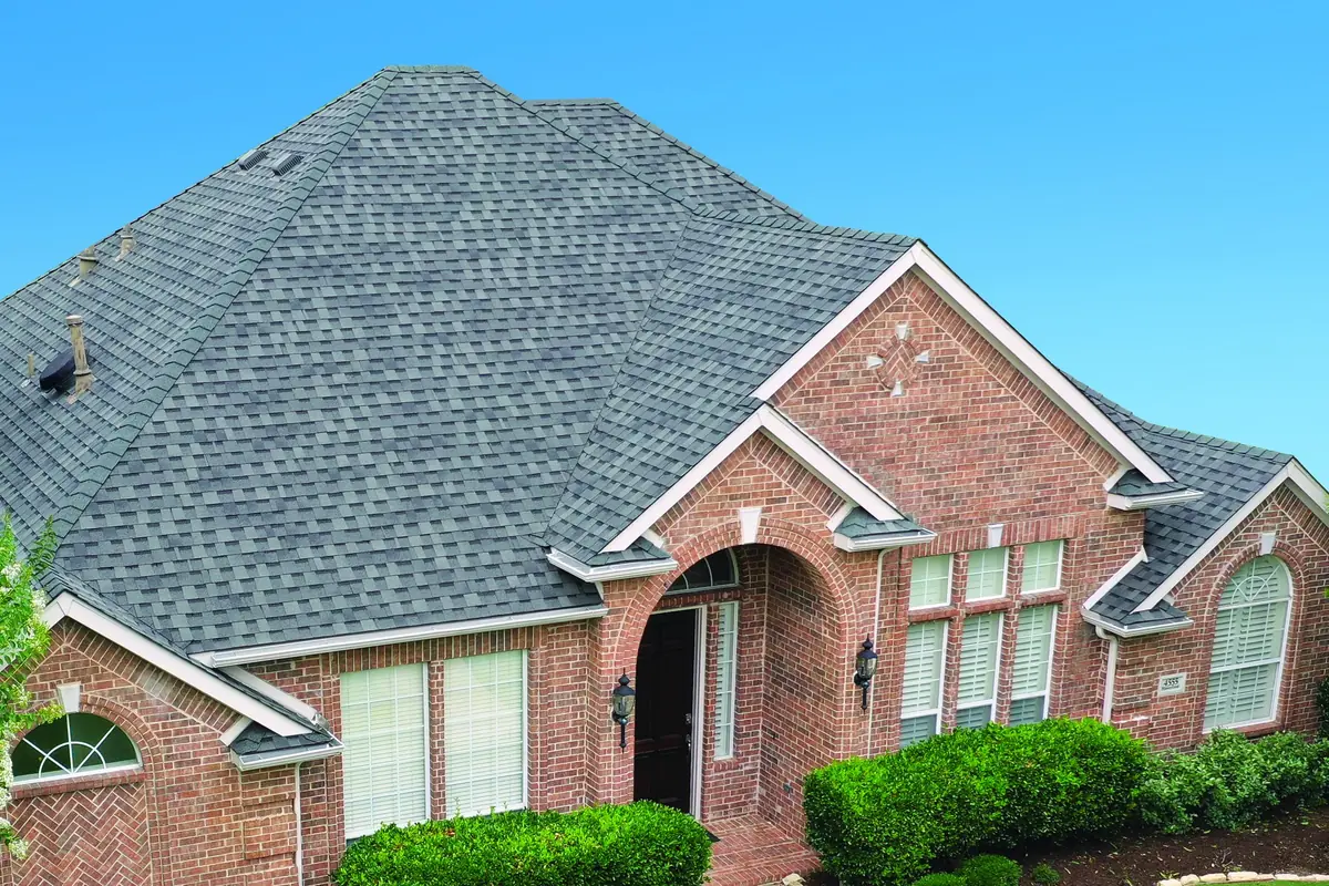 Red brick home with an Atlas StormMaster Shake roof in Pewter