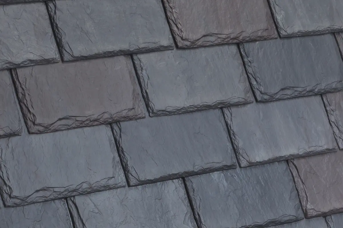 Close-up of DaVinci Single-Width Slate tiles in the European blend, showing chiseled edges and color variation