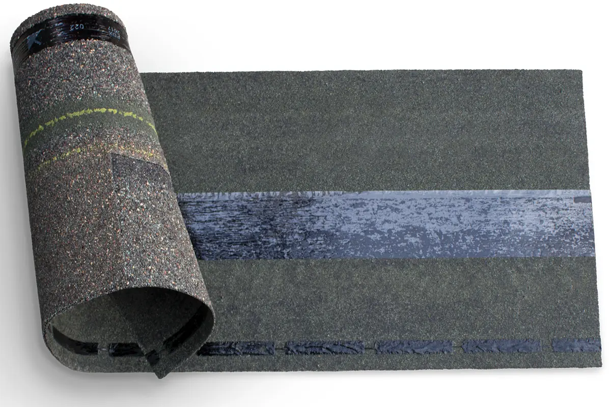 Malarkey Vista shingle curled back on itself to show how flexible the SBS rubberized asphalt stays