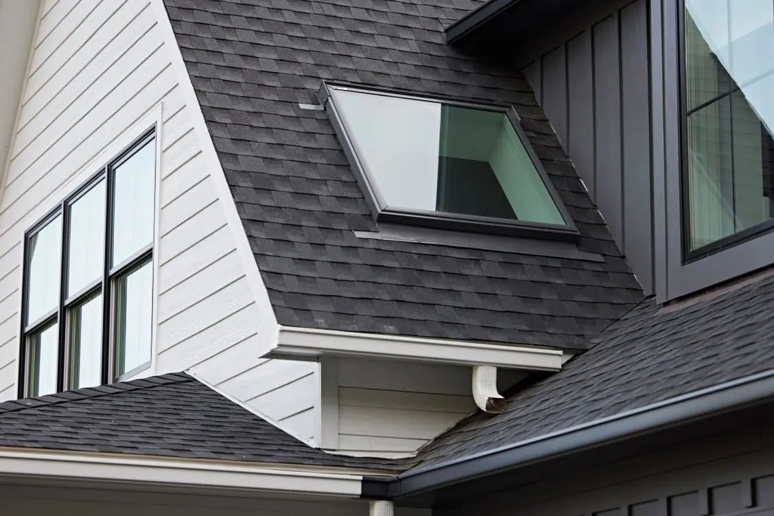 VELUX fixed skylight sitting low and flush in an asphalt shingle roof