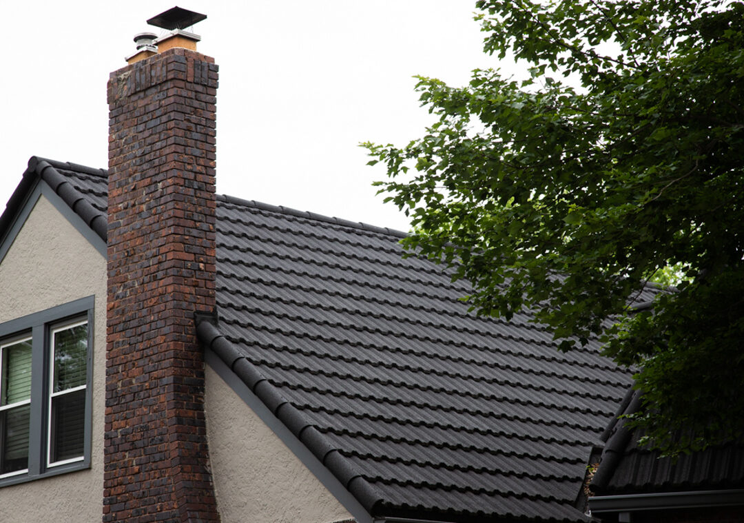 Unified Steel metal roof meeting brick chimney with custom flashing