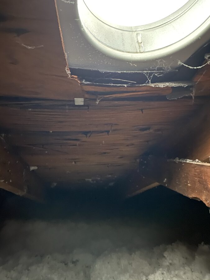 Attic decking and insulation inspected for ventilation in an Omaha home