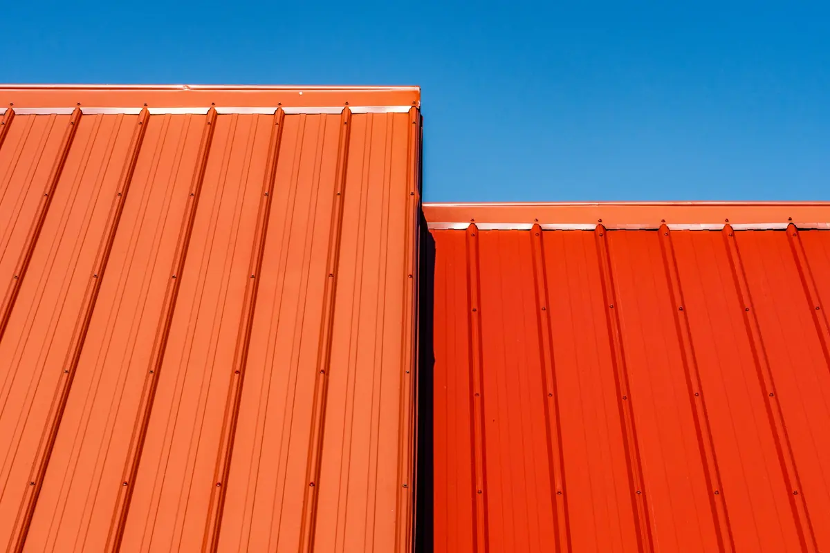 Painted ribbed steel panels showing the major and minor ribs and rows of screws
